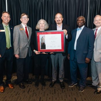 Celebrating RMV RMV Co-directors Dori Miles and Richard Fording (Center L and Center R) pictured with UA's Excellence in Community Engagement Award