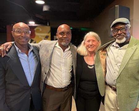 Restored voters Joe Bennett (left), Ron McKeithen (center left), and Lee Garrett (right) posing with RMV co-director Dori Miles (center right) at GBM's celebration for restored voters